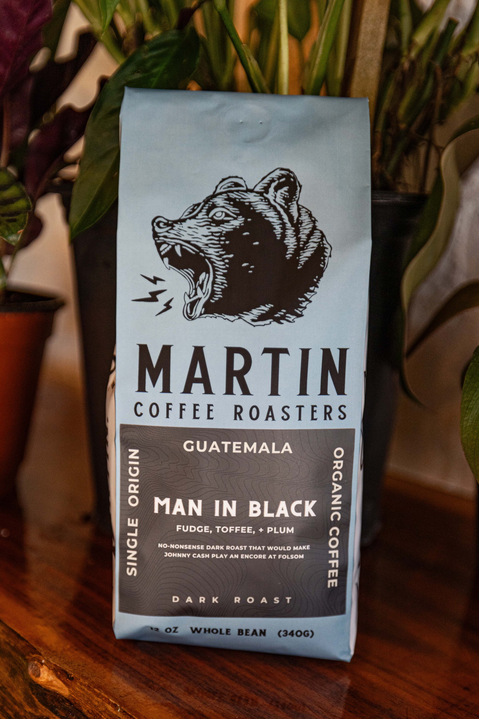 Man in Black  A no-nonsense dark roast that would make Johnny Cash play an encore at Folsom. Single-origin Guatemala Organic by nature Dark Roast Tasting notes: Fudge, Toffee, + Plum Elevation 1400 - 1600 MASL Process Washed Cultivar Bourbon, Caturra www.MartinCoffeeRoasters.com 